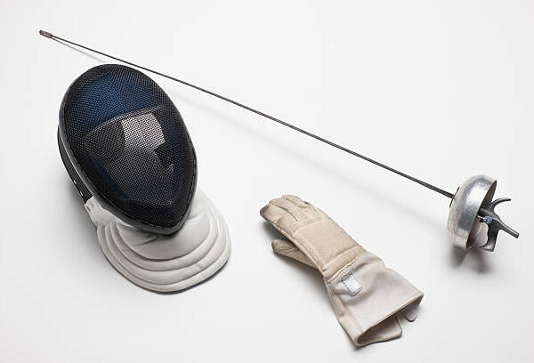 Utstyr "Fencing gear - equipment. Fencing eppe - sword, mask and glove on white background. Very shallow DOF . The grain and texture added.SEE ALSO:"